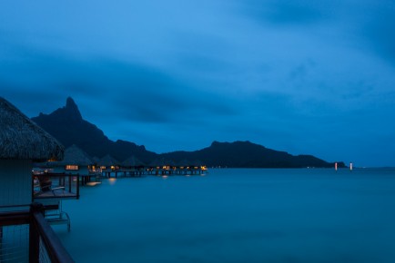 Night view of overwater bungalows of Le Méridien Bora Bora agai