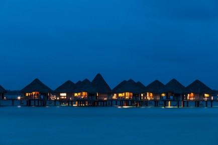 Night view of overwater bungalows of Le Méridien Bora Bora