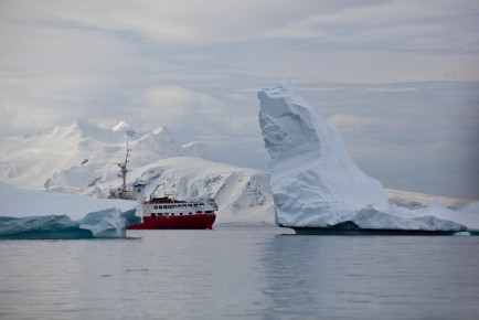M/V Antarctic Dream behind icebergs, Cuverville Island
