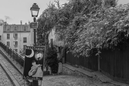 A restaurant sign on Rue Poulbot, Montmartre, Paris