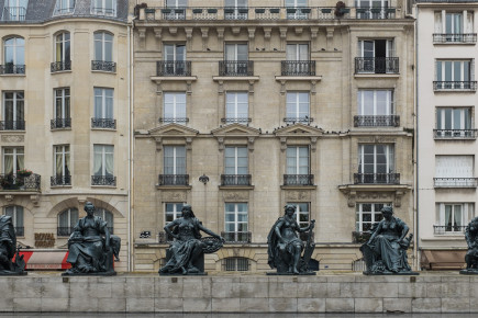 The statues of the six continents at the esplanade of the Musée